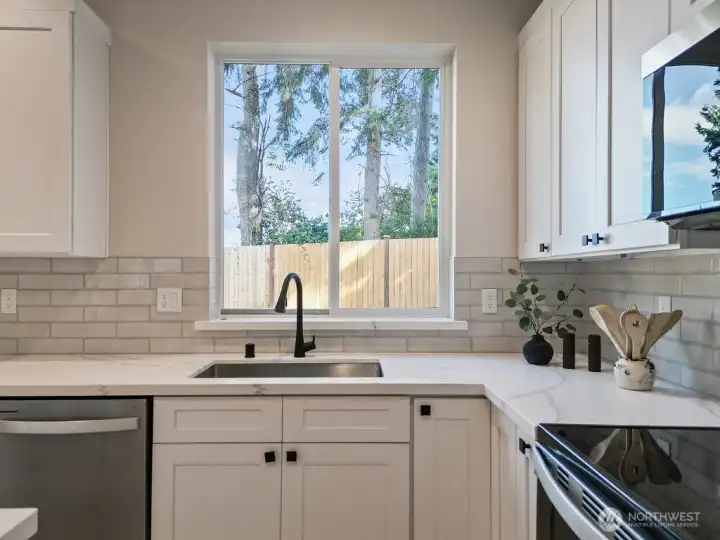You will love the window over the sink with view of backyard