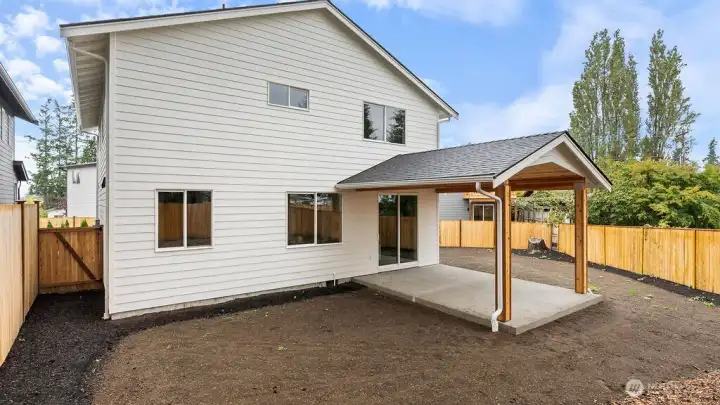 Spacious back yard is fully fenced with gate access and huge covered patio that is perfect for relaxing and entertaining guests.