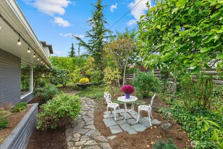 Garden spaces galore - bring your green thumb and let your imagination run wild in this English Garden inspired front yard complete with fruit trees!
