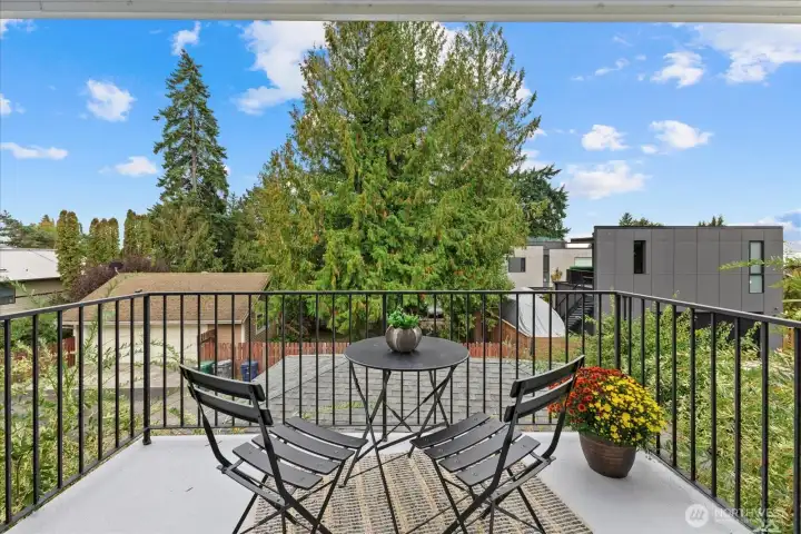 Your very own private primary suite balcony is the perfect spot to take in golden Olympic Mountain sunsets and partial views of the City of Bellevue.