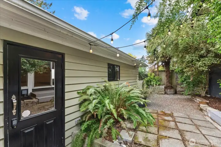 Back of the house has easy access to the detached 1-car garage with EV charger.