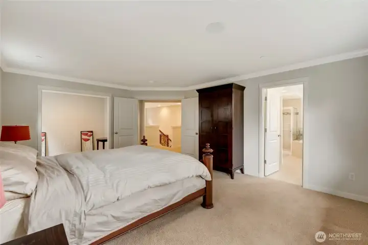 This view showcases the generous layout of the owner’s suite, including access to a sitting area and spa-style ensuite bath. Its thoughtful flow offers privacy, comfort, and space to unwind at the end of the day.