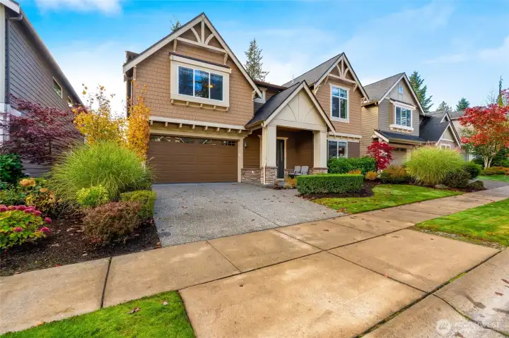Immaculately maintained exterior with Craftsman-inspired details, manicured landscaping, and a two-car garage. Excellent curb appeal in a sought-after neighborhood.