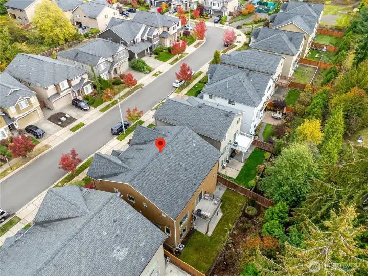 Beautiful aerial perspective showcasing the home’s location within a quiet, tree-lined community. Conveniently positioned near local parks, trails, and shopping with easy access to major routes.