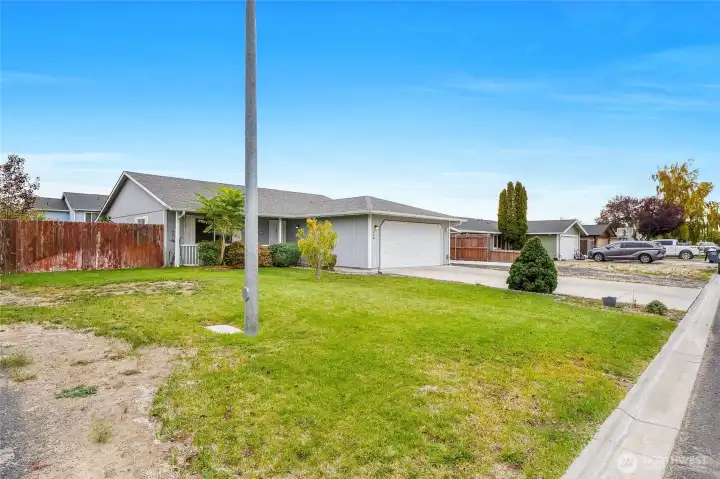 The left side yard in front.