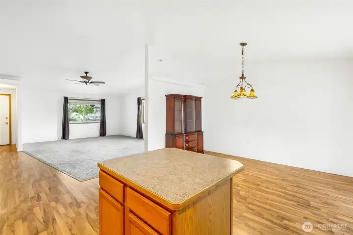 Kitchen, dining room, and living room.  Beautiful light fixture in the dining area.