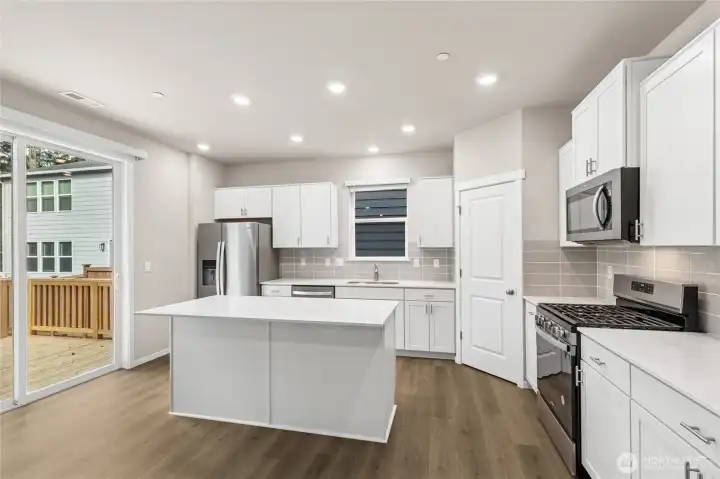 Gourmet kitchen with gas range. 10'x12' deck off kitchen