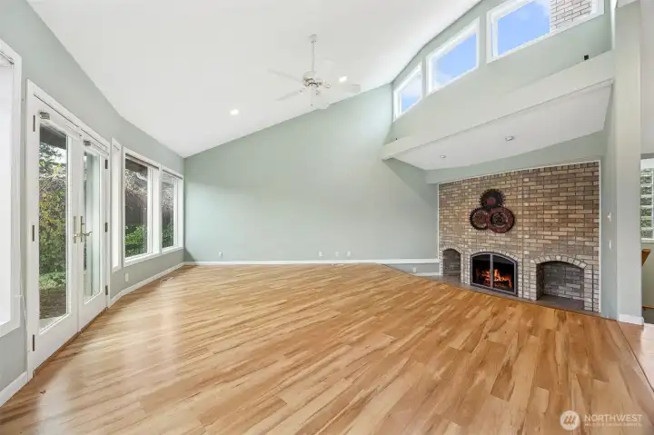 Bright natural lighting in living room with gas fireplace
