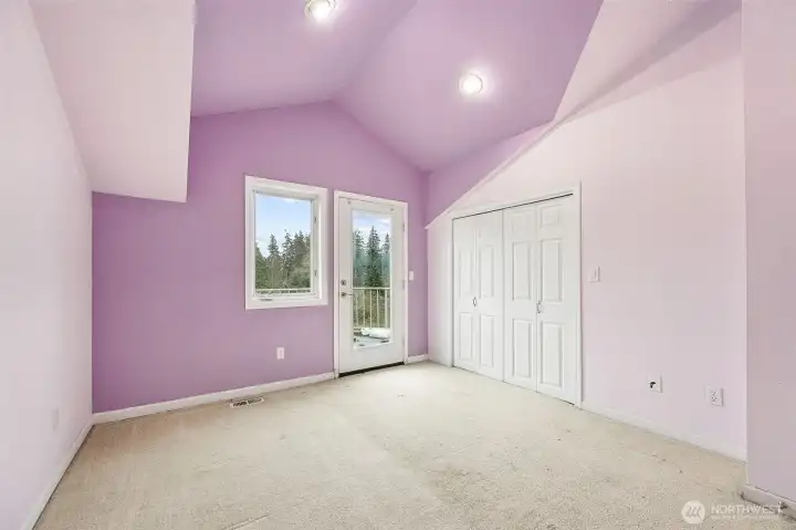 Middle upstairs room with exterior door to top deck. View of Mt. Rainier