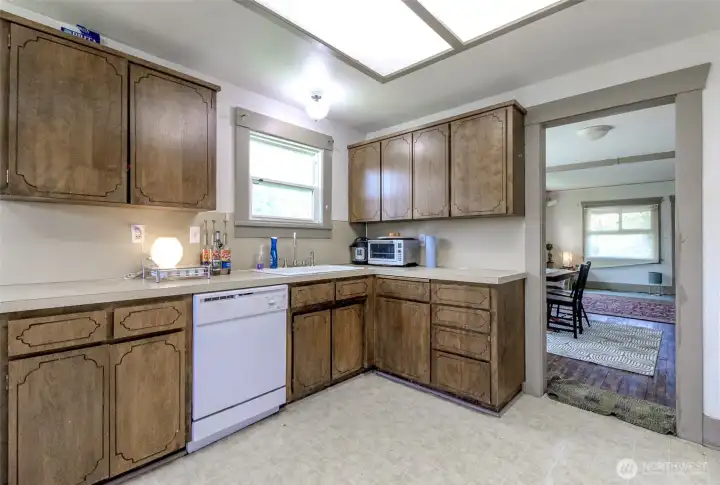 Lots of windows in the kitchen.  There is a dish waster and the ove and fridge will stay.  Water filtration system under the sink will stay as well!