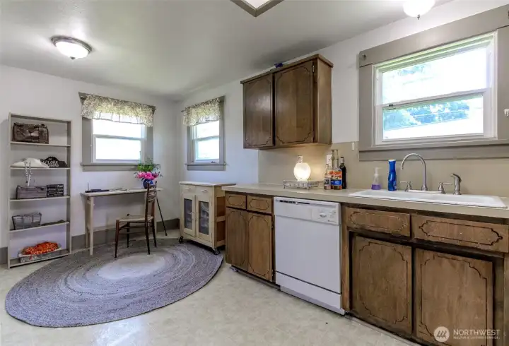 There is a dining area in the kitchen which is currently used for office space