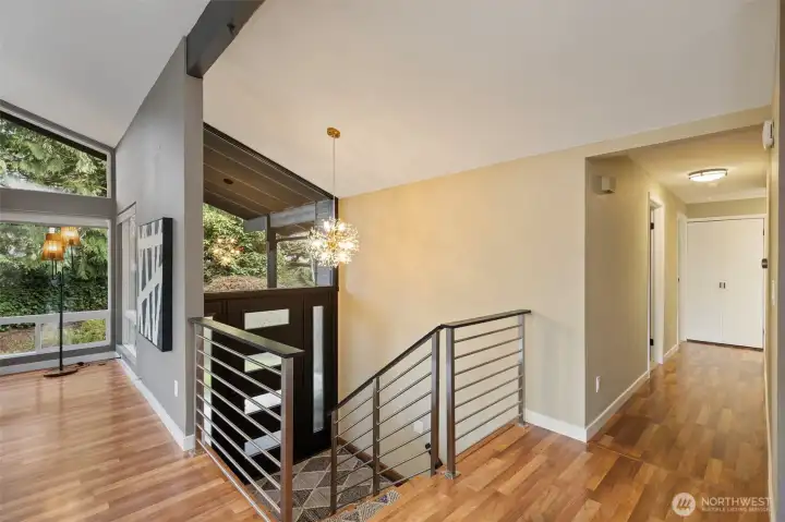 Living room to your left, 3 bedrooms down the hall and dining/kitchen to your right.