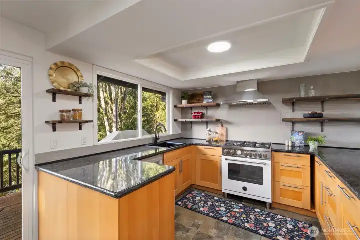 Renovated kitchen with newer appliances & granite countertops.