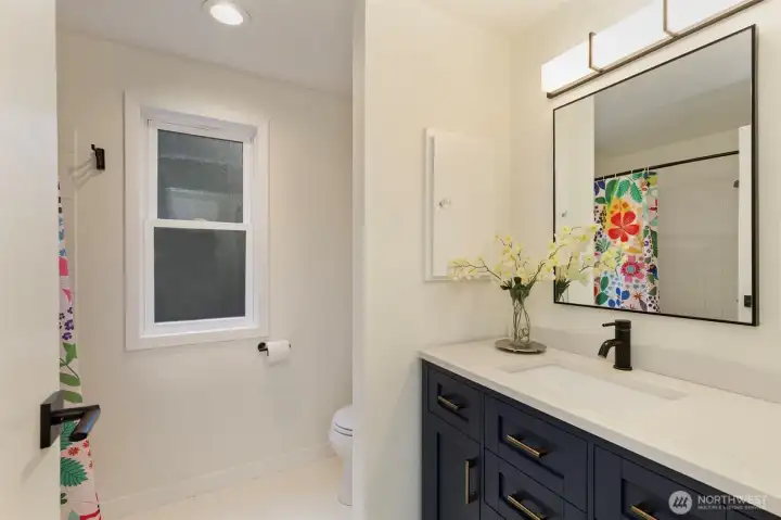 Shared refreshed, full bath on main level.