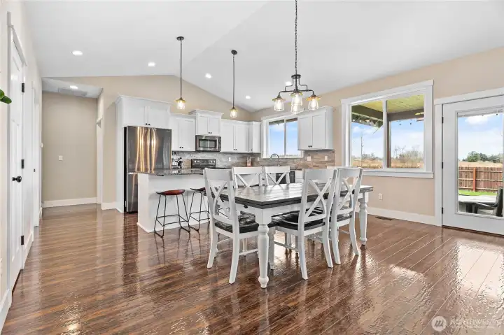 Tons of natural light throughout this great room; plenty of space for nearly any size dining table!