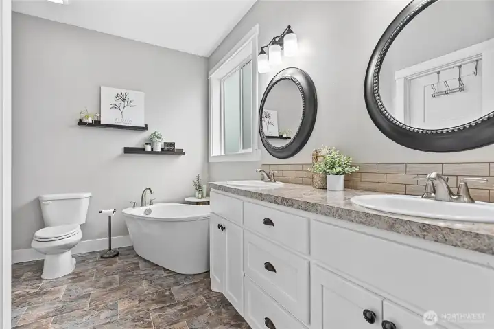 Very spacious ensuite bathroom w/dual vanity, free standing tub, fully tiled walk-in shower & walk-in closet