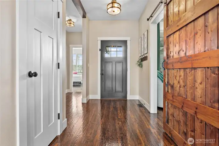 Just love the well thought out floor plan of this home! And the extra touches like the barn door, light fixtures, AC & more