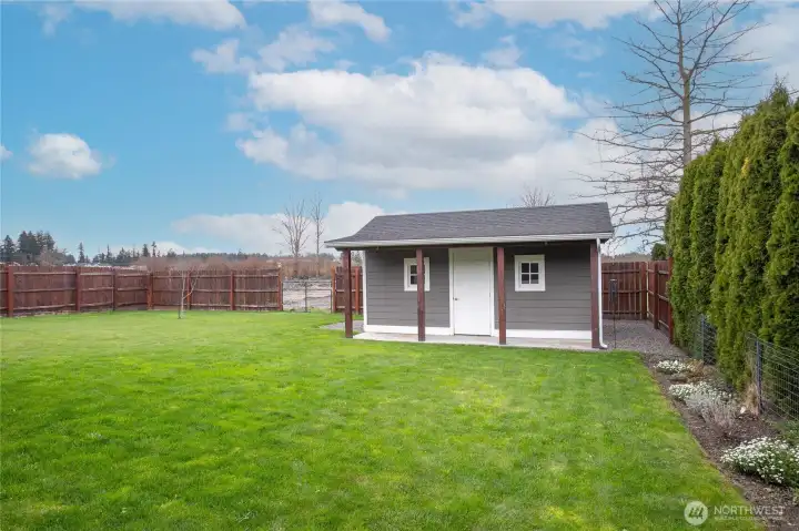 Garden shed with standard door plus garage door & attic storage