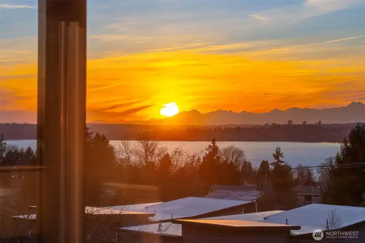 Absolutely stunning sunset views from both the balcony and interior of this lovely Houghton condo
