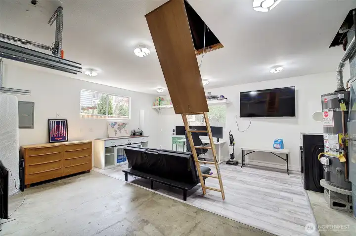 Drop stair to lighted storage space.