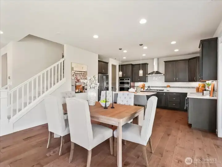 Seamlessly connected dining space perfect for entertaining beside the kitchen.