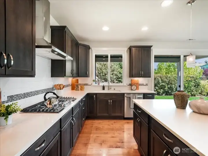 Open-concept kitchen designed to seamlessly connect cooking and conversation.