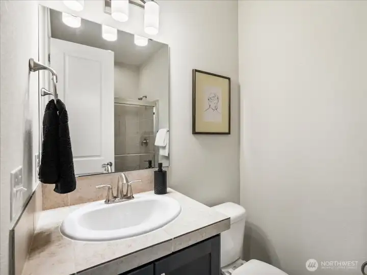 Main-level bath with walk-in shower for everyday convenience.