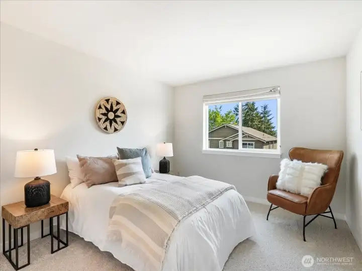 Thoughtfully designed bedroom featuring a spacious walk-in closet and airy feel.