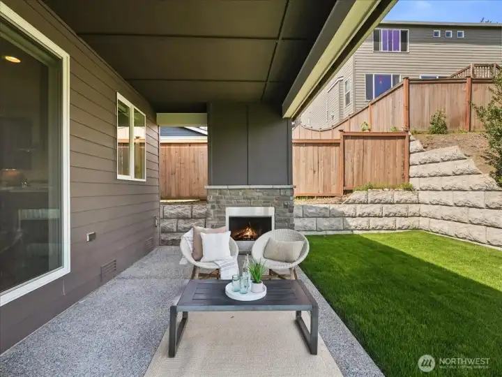 Gas fireplace and built-in BBQ connection create effortless outdoor entertaining.