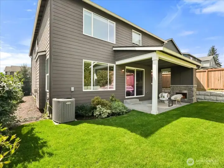 Beautifully designed outdoor retreat with fresh sod and inviting gathering spaces.