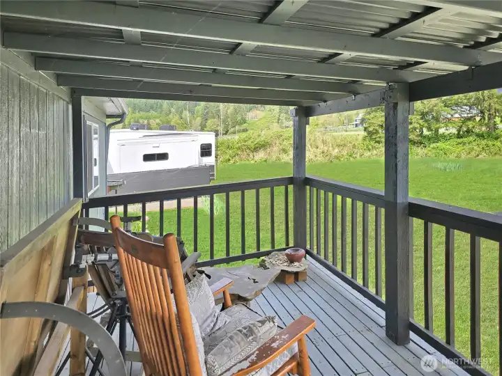The covered deck is the perfect place to enjoy outdoor dining this summer