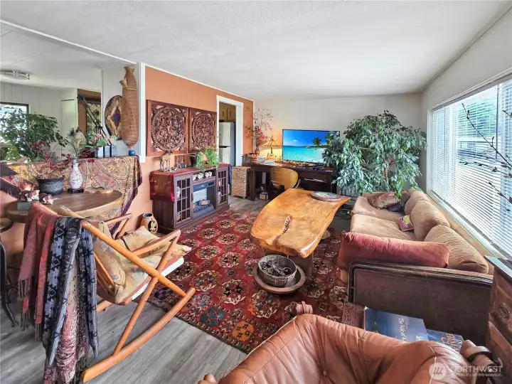 Second view of the living room. The couch could stay if you would like and the electric fireplace will stay.