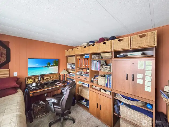The wall storage unit in the bedroom will stay.