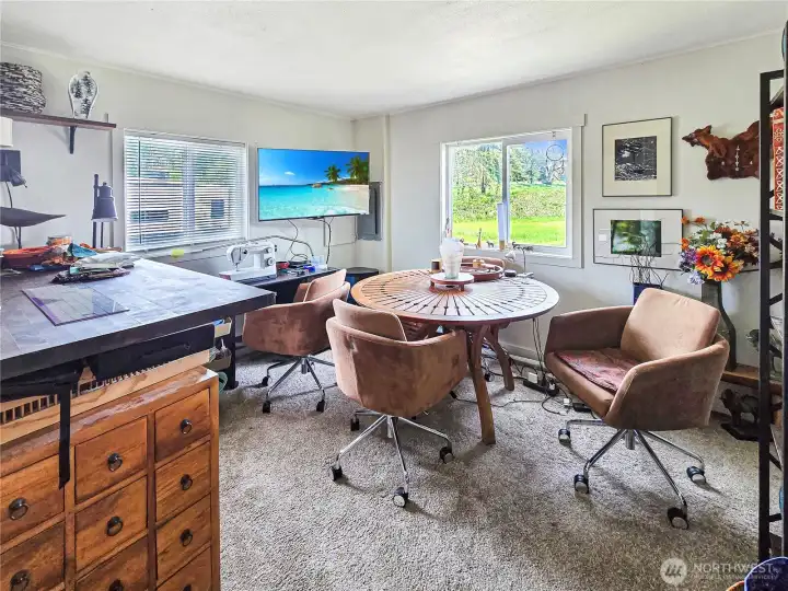 Comfortable primary bedroom with private updated bath and peaceful setting. Currently being used as an artist studio.