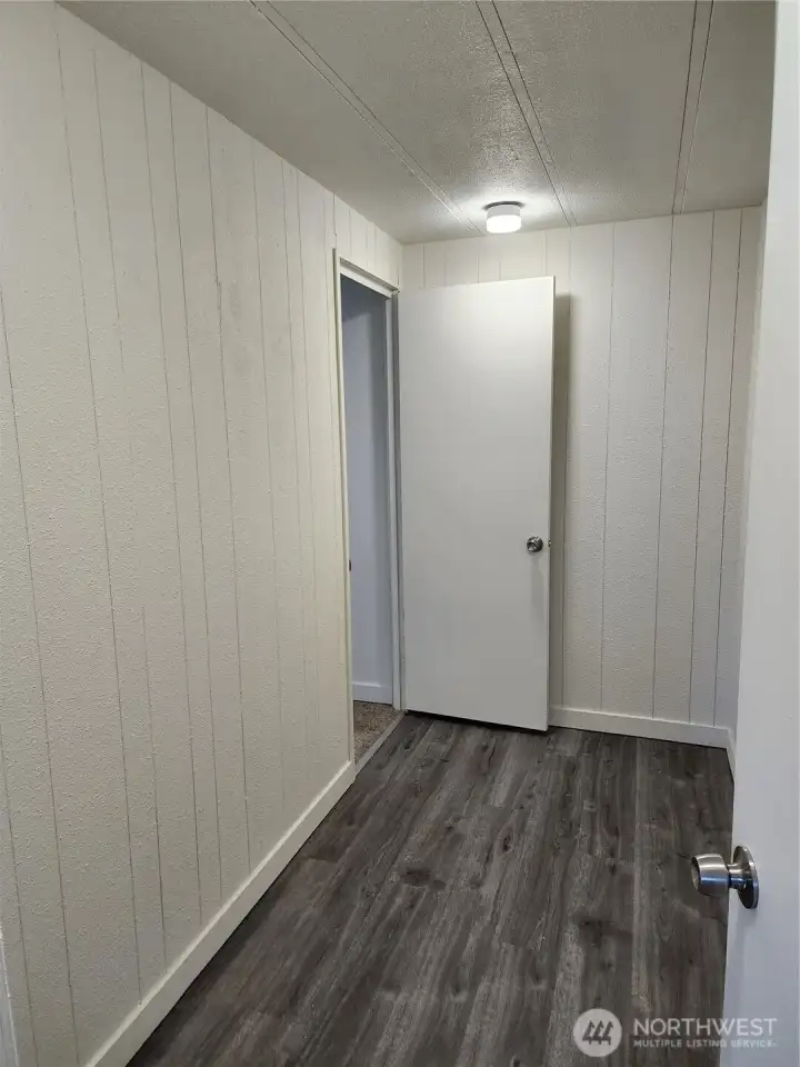 Prior to storage being installed the huge walk in closet that is shared by both bedrooms.