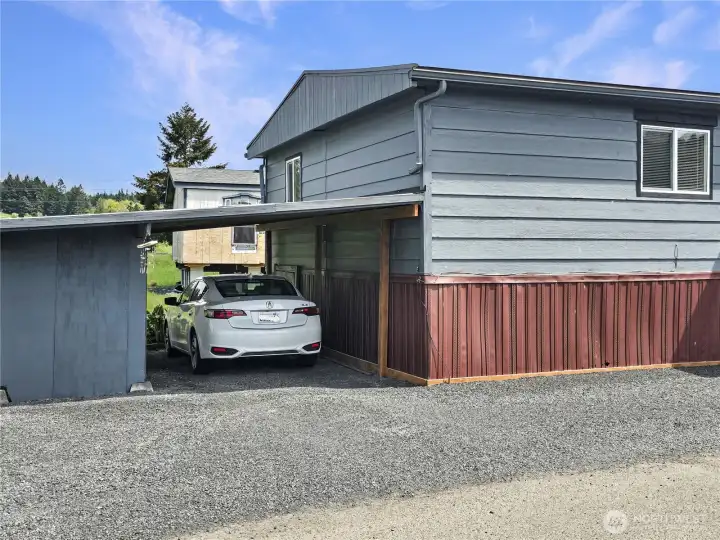 Rare covered carport parking with additional designated parking space.