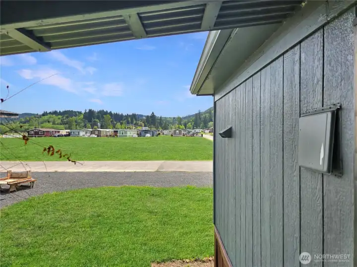 View as you walk down the stairs from the back deck into the yard.