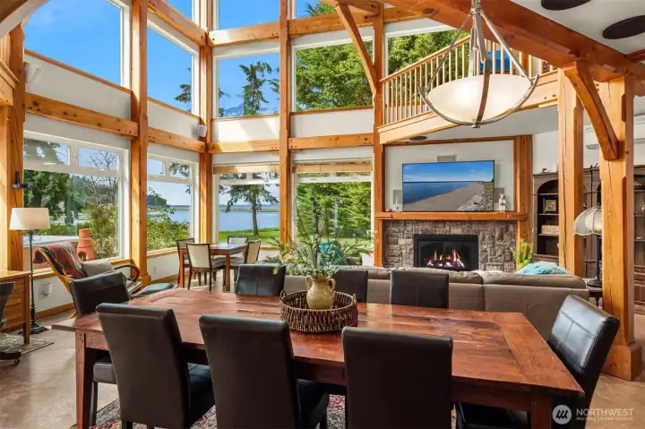 Soaring ceilings and walls of glass fill the home with natural light, while from the comfort of your couch you can watch blue herons perched among the treetop. Soaring ceilings and walls of glass fill the home with natural light, while from the comfort of your couch you can watch blue herons perched among the treetop.