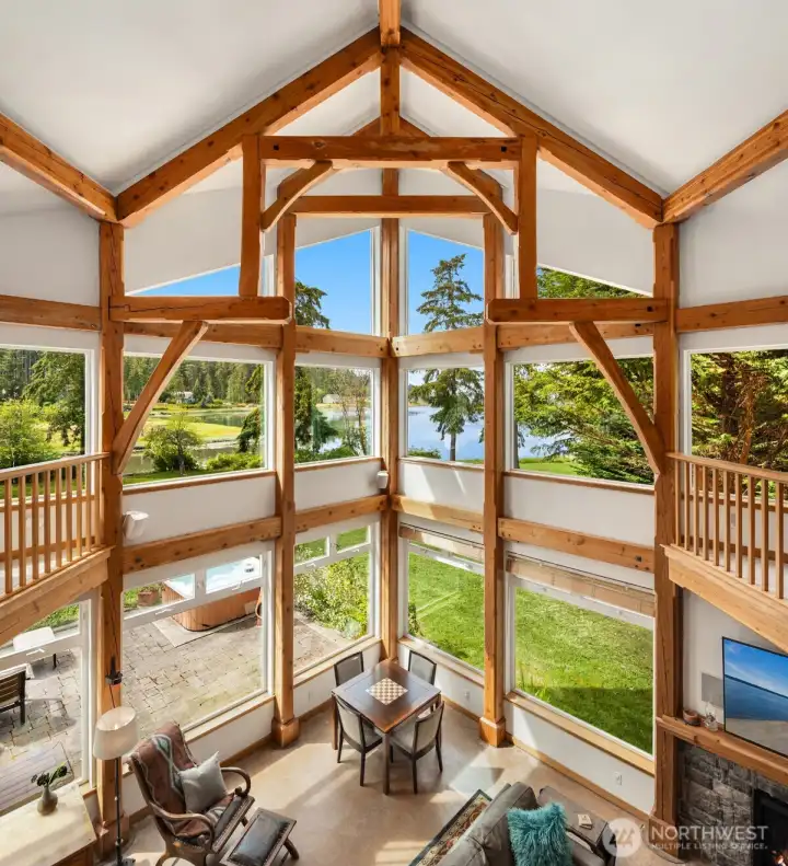 With its soaring timber-frame design and dramatic exposed beams, this home makes a lasting impression and is sure to be a conversation piece with every guest. With its soaring timber-frame design and dramatic exposed beams, this home makes a lasting impression and is sure to be a conversation piece with every guest.