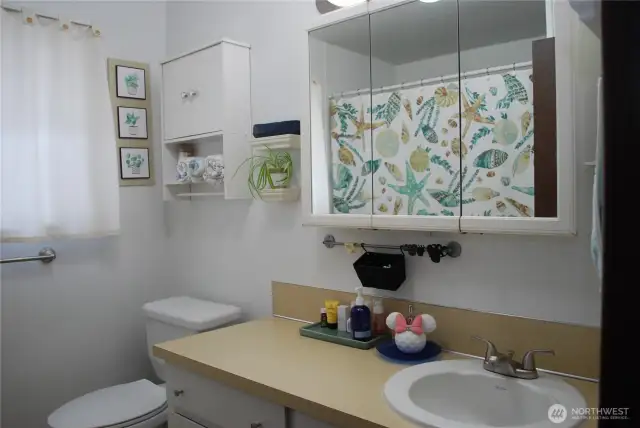 Bathroom with glass shower doors.