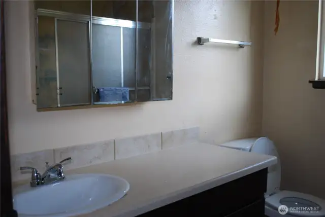 Bathroom with glass shower doors.