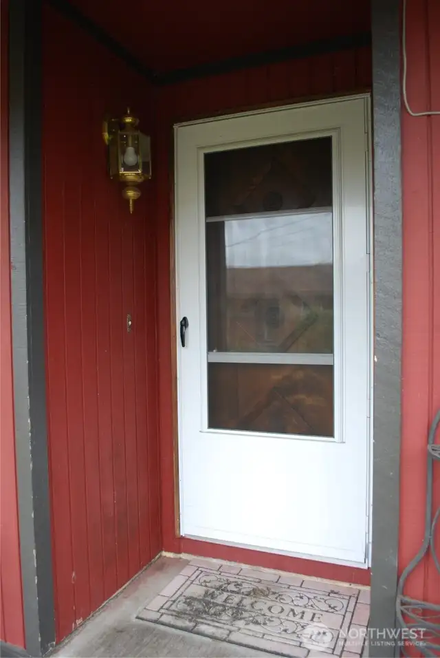 7710 Storm door entry welcomes guests with comfort in mind.