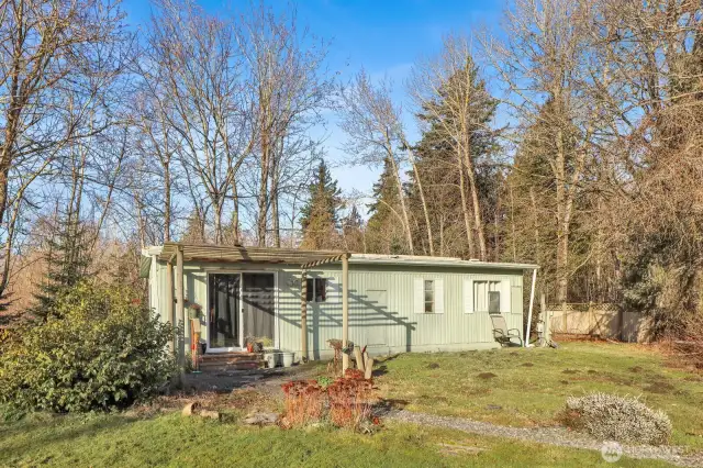 Next door to the main house is a manufactured home that has been well maintained.