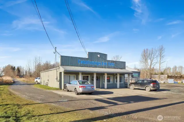 At the from of the property is the showroom with amazing Guide Meridian road frontage.