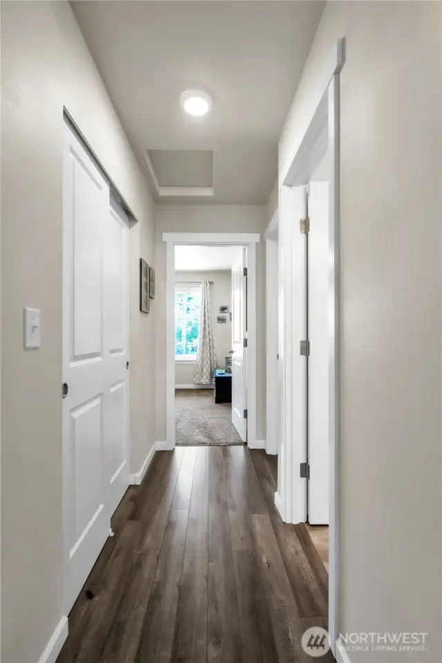 Easy-care laminate flooring in hallways.