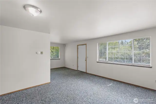 Unit B includes this spacious living room with great light and outlook.