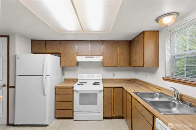 The kitchen in Unit A includes pantry, refrigerator, range, dishwasher.