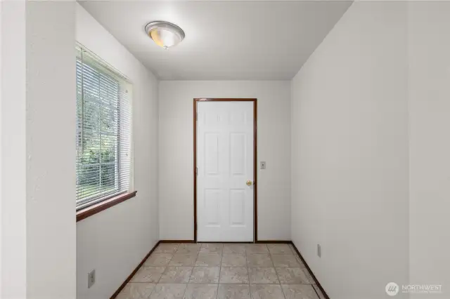 The nook/storage area between the kitchen and garage for Unit A.