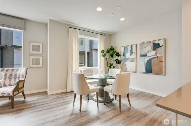 Dining Area - Notice the Large Windows and Engineered Hardwood Floors