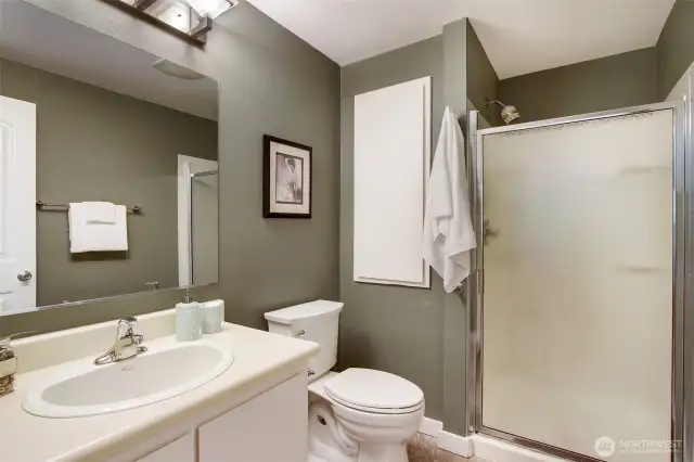 Primary Bath is connected to the bedroom, for privacy and convenience. The cream and evergreen color palette bring the outside in...